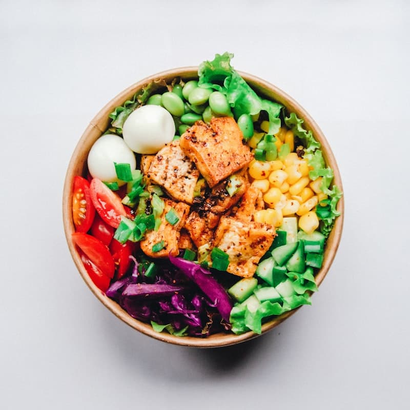 Colorful poke bowl with fresh vegetables