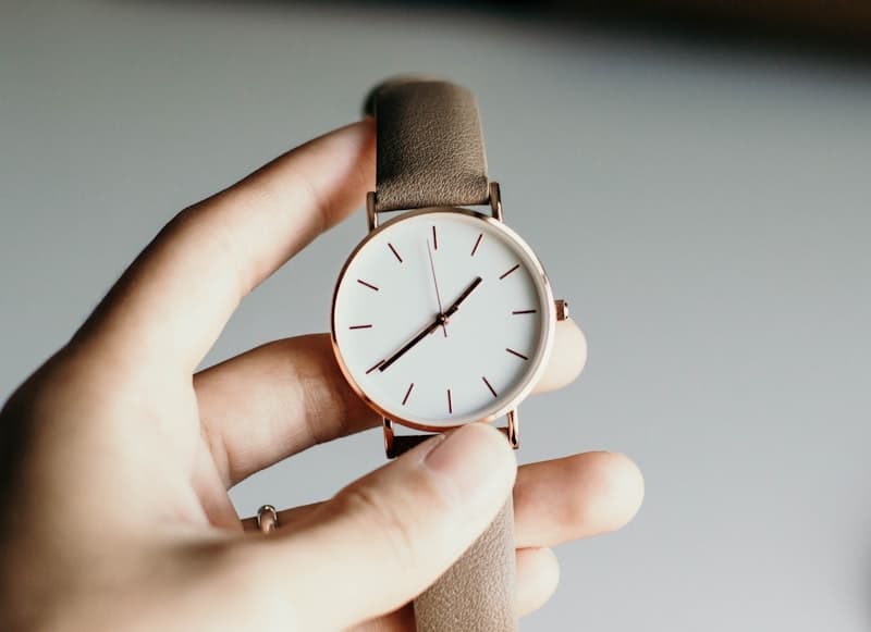 Minimalist wristwatch on white background